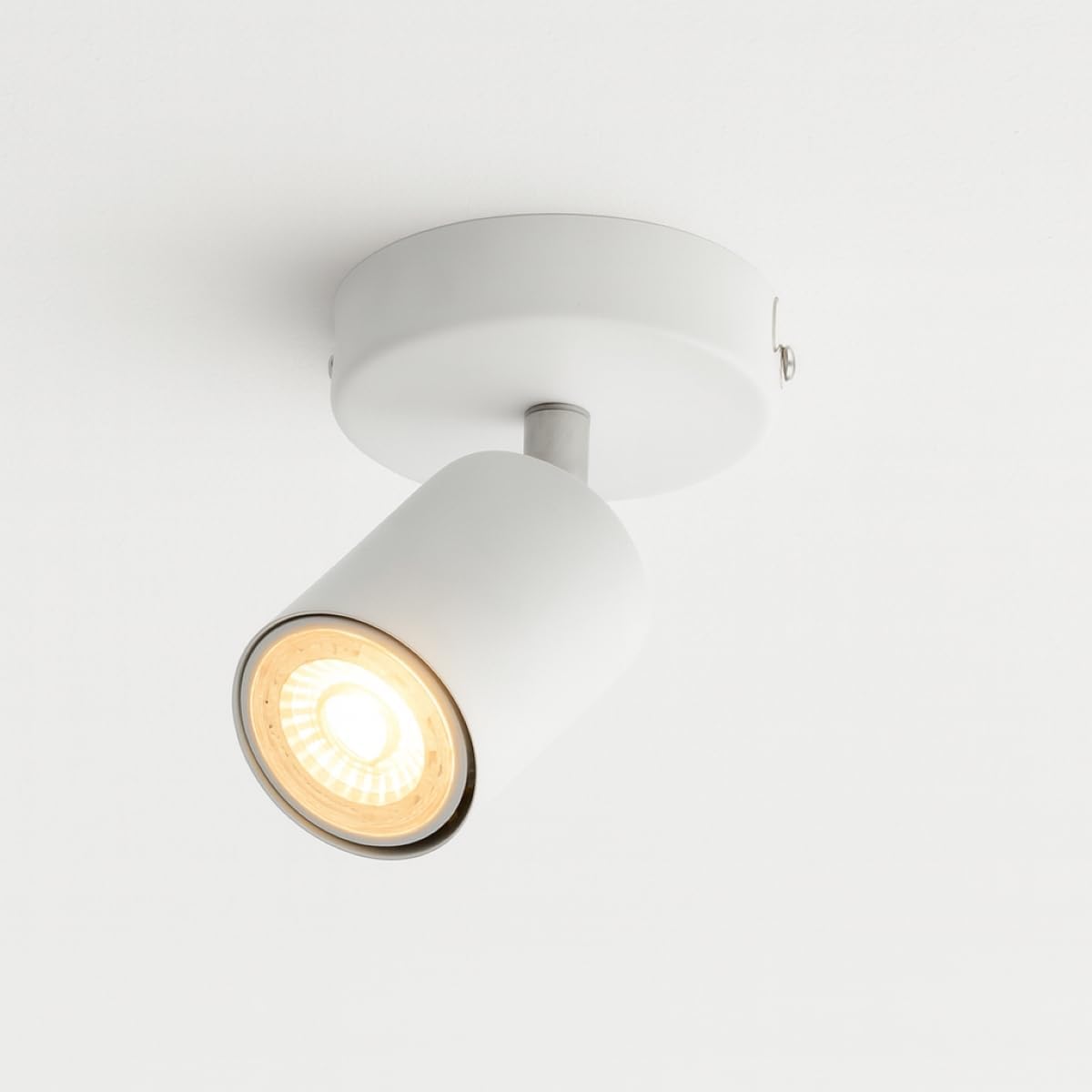 White ceiling light fixture on a white background