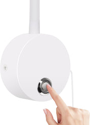Hand pressing a button on a white cylindrical device with a light gray center against a white background