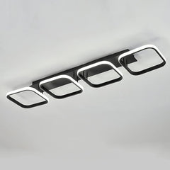 Modern ceiling light fixture with square design on a gray background