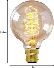 Vintage-style light bulb with spiral filament and measurements on a white background
