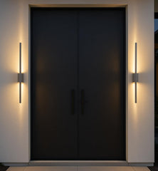 Modern black door with wall lights on a neutral background