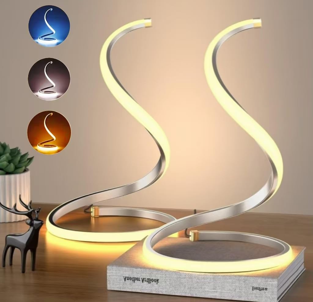 Modern table lamp with curved design on a wooden surface, featuring color options above it.