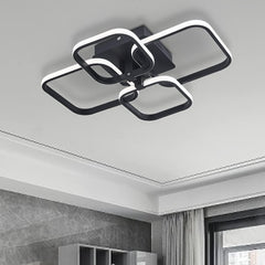 Modern ceiling light fixture in a room with gray walls and a window.