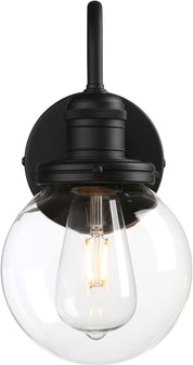 Black wall-mounted light fixture with clear glass shade on a white background