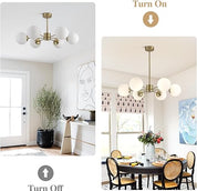 6-Light Globe Sputnik Chandelier with white milk glass shades and brushed gold finish. Mid-century modern pendant light for dining or living rooms.