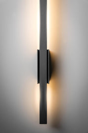 Modern wall-mounted light fixture on a neutral background