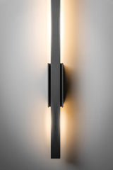 Modern wall-mounted light fixture on a neutral background