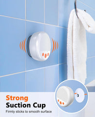 White suction cup with orange accents on a blue tiled wall, featuring text about strong suction.
