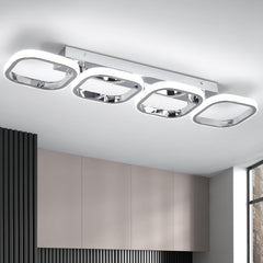 Modern ceiling light fixture in a room with neutral walls and a window.