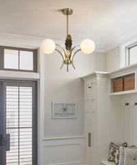 Modern chandelier in a room with white walls and a door.