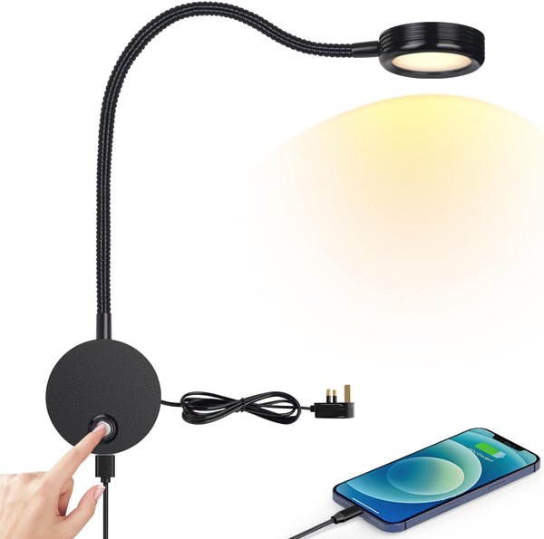 Black adjustable desk lamp with a smartphone on a white background