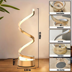 Gold spiral table lamp with detailed components and measurements on a wooden surface.