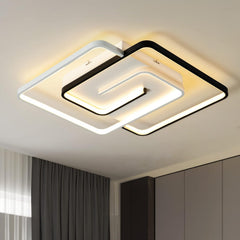 Modern square ceiling light fixture in a room with neutral decor
