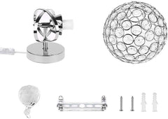 Set of decorative lamp parts including a crystal ball, metal bracket, and screws on a white background.