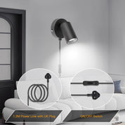 Wall-mounted black light fixture with power cord and on/off switch in a living room setting.
