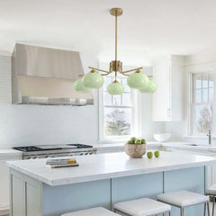 Modern kitchen with a pendant light fixture, stove, and island.
