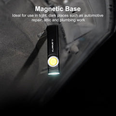 Flashlight with magnetic base on a dark surface, ideal for tight, dark places.