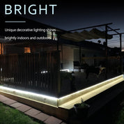 Outdoor deck with embedded lighting at night, highlighting the 'BRIGHT' feature.