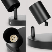 Black lamp with socket and bulb on a light gray background