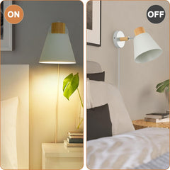 Wall-mounted lamp with 'ON' and 'OFF' labels in a bedroom setting.