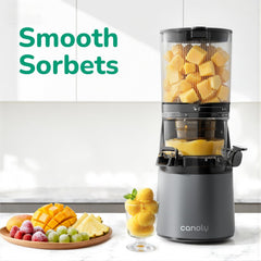 Juicer with fruits and sorbets on a kitchen counter, featuring the brand 'canoly'.