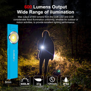 Blue flashlight with 600 lumen output in a dark outdoor setting