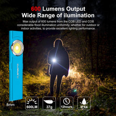 Blue flashlight with 600 lumen output in a dark outdoor setting