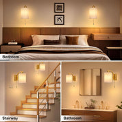 Bedroom, stairway, and bathroom scenes with wall-mounted lamps.