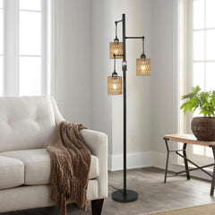 Floor lamp with multiple lampshades in a living room setting.