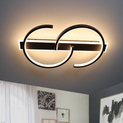 Modern ceiling light fixture with circular design in a room setting