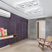 Modern interior room with purple walls, wooden furniture, and a chair.
