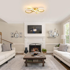 Living room with white sofas, a wooden coffee table, and a fireplace.