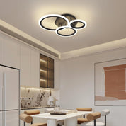 Modern ceiling light fixture in a kitchen setting with neutral tones.