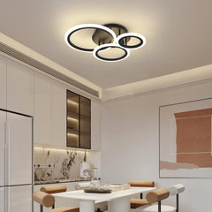Modern ceiling light fixture in a kitchen setting with neutral tones.