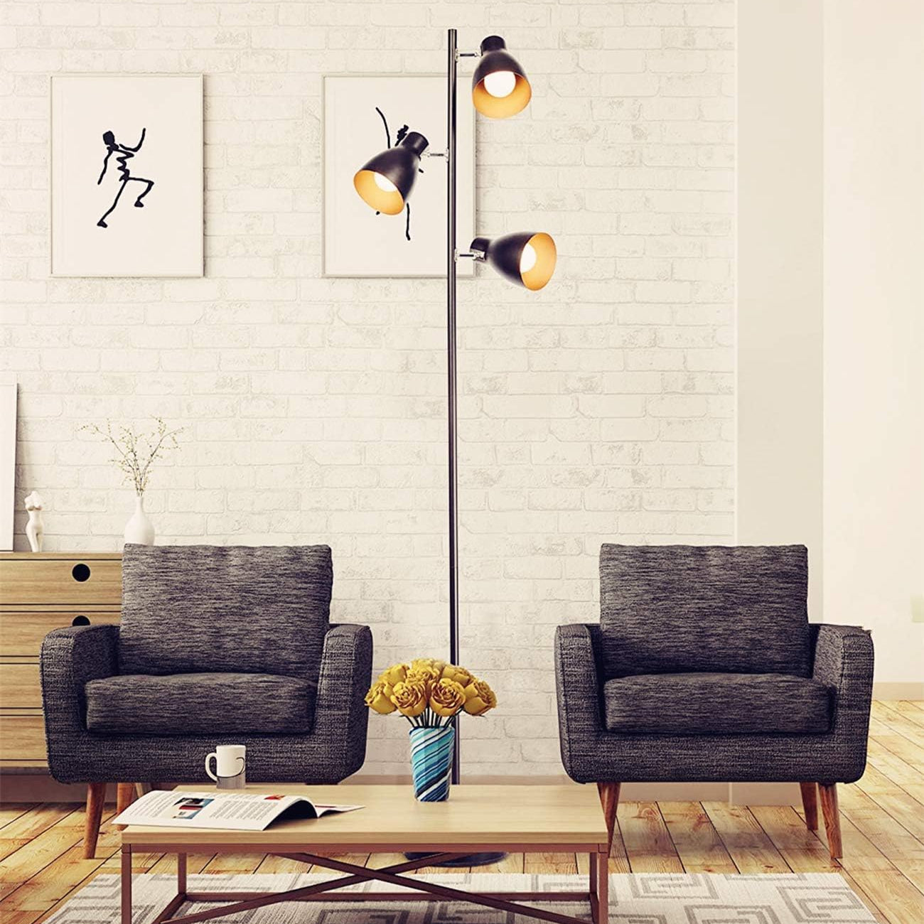 Modern living room with two gray armchairs, a coffee table, and a floor lamp.