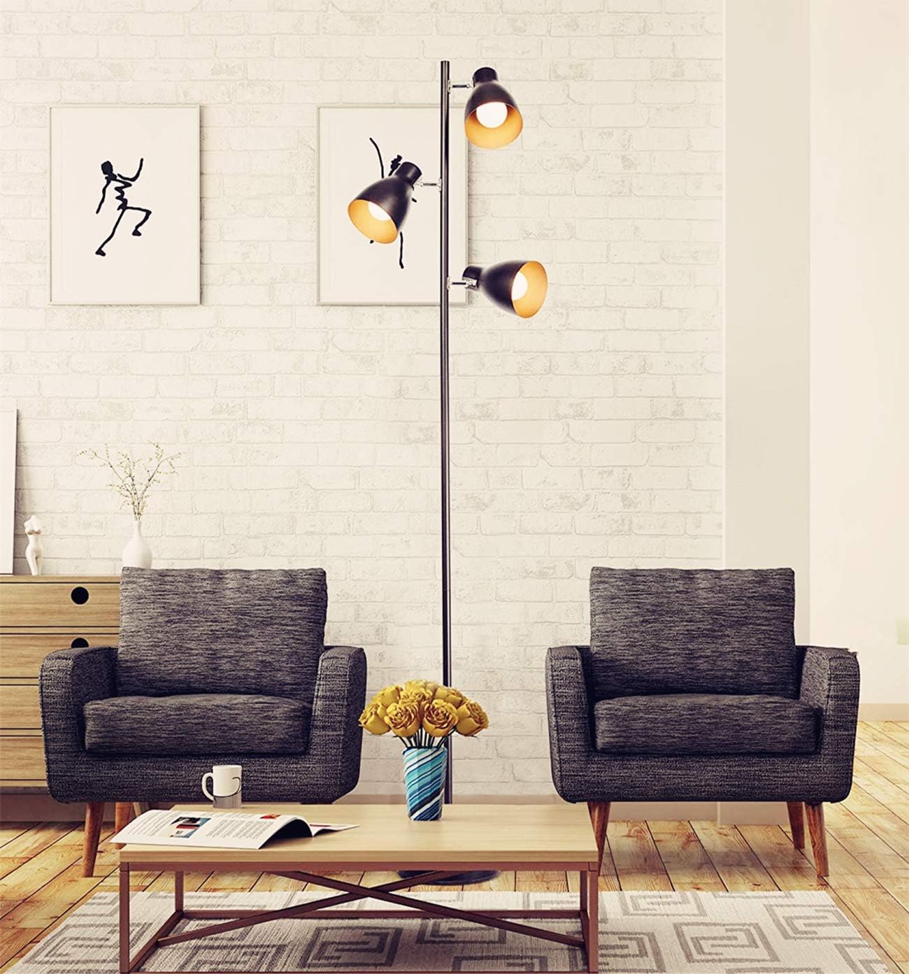 Modern living room with two gray armchairs, a coffee table, and a floor lamp.