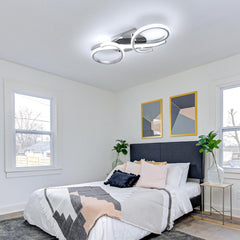 Modern bedroom with a bed, nightstands, and wall art.