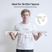 Person holding a white metal frame with measurements, ideal for 20-25m² spaces.