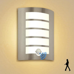 Modern wall-mounted light fixture with sensor on a beige wall.