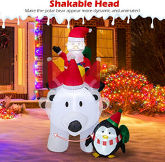 Inflatable Santa and penguin Christmas display