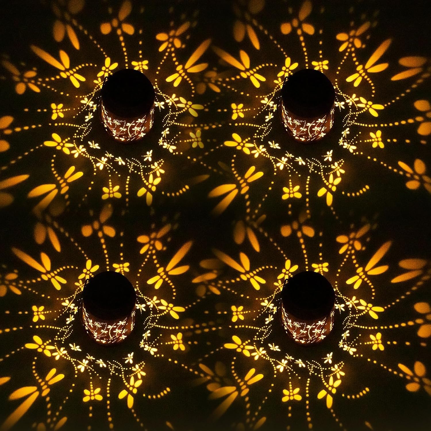 Decorative light fixture with floral patterns projected onto a dark surface