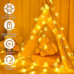 Star fairy lights with a teddy bear inside a wooden teepee against an orange curtain.