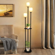 Three-tiered floor lamp with plants in a living room setting