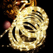 Coiled string light with warm glow on a dark background