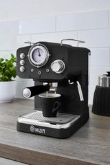 Black Swan espresso machine on a wooden surface with a white tiled wall in the background