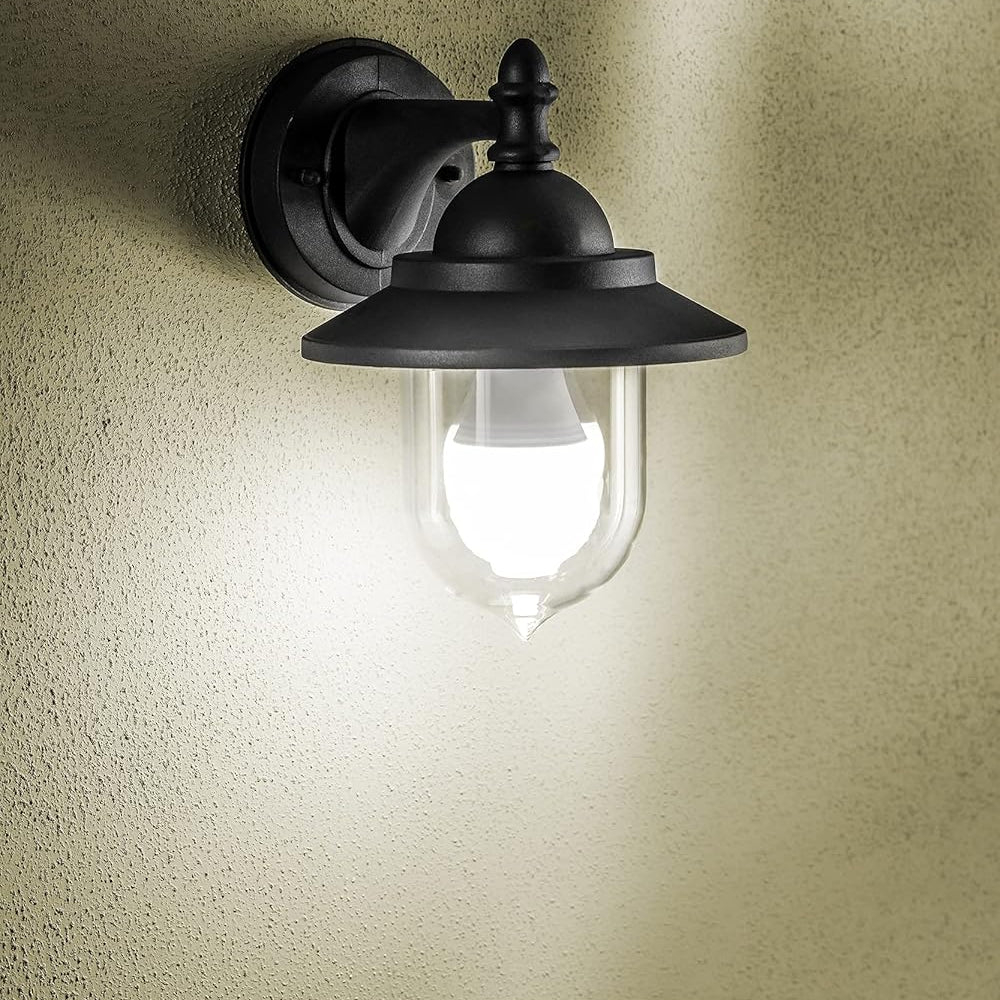 Black outdoor wall light fixture on a textured wall