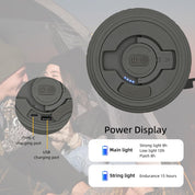 Black portable light with charging ports and power display on a blurred background