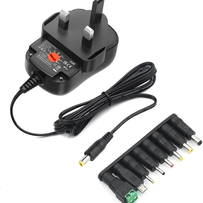 Black power adapter with multiple plug heads on a white background