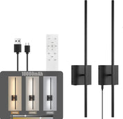 Black wall-mounted light fixture with remote control and USB cable on a white background