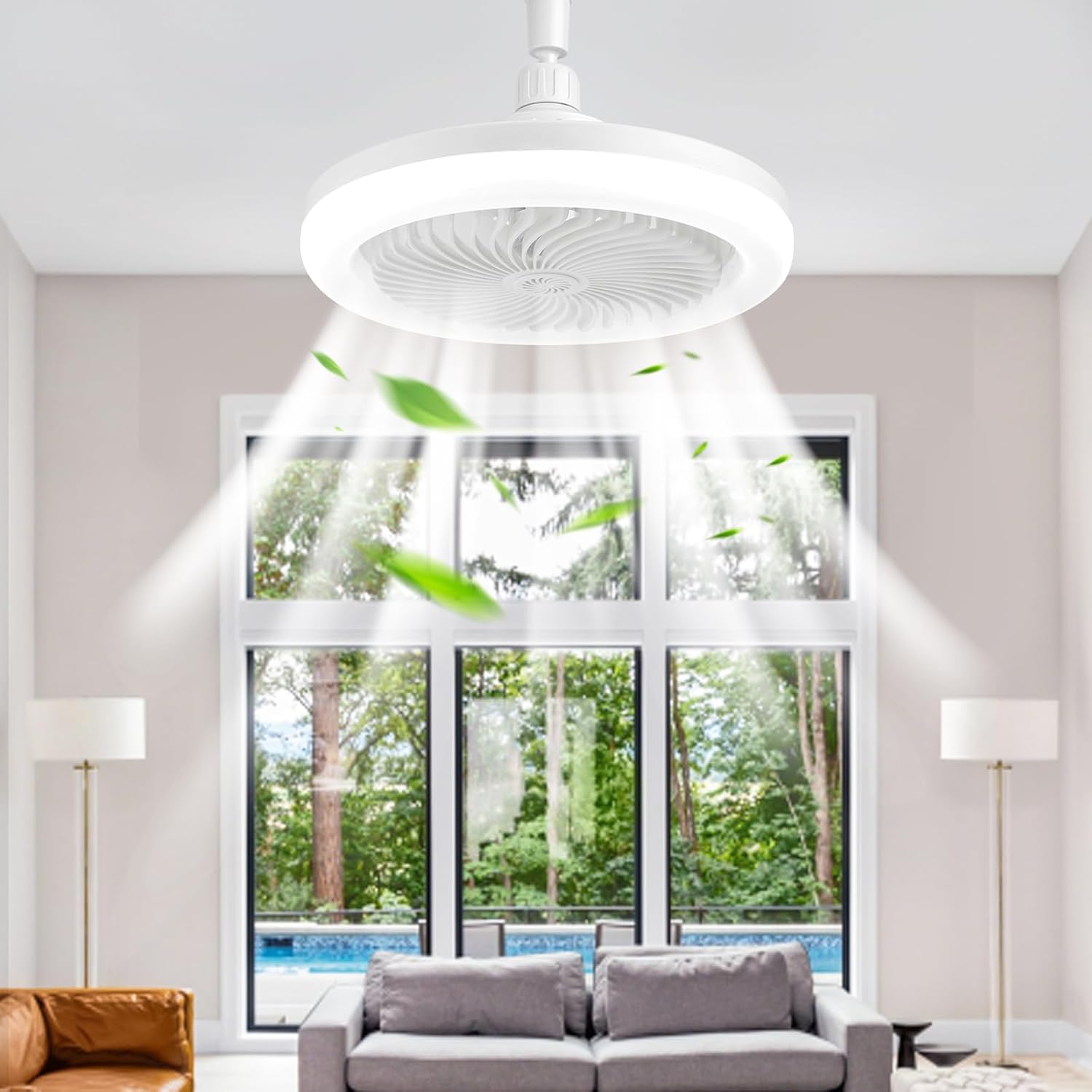 Ceiling fan in a room with a large window view of trees and a pool.